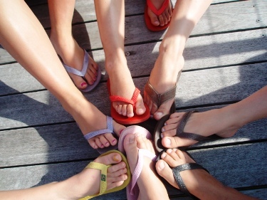 Featured is a photo of "a gathering of flip flops" by an unidentified Australian photographer.
